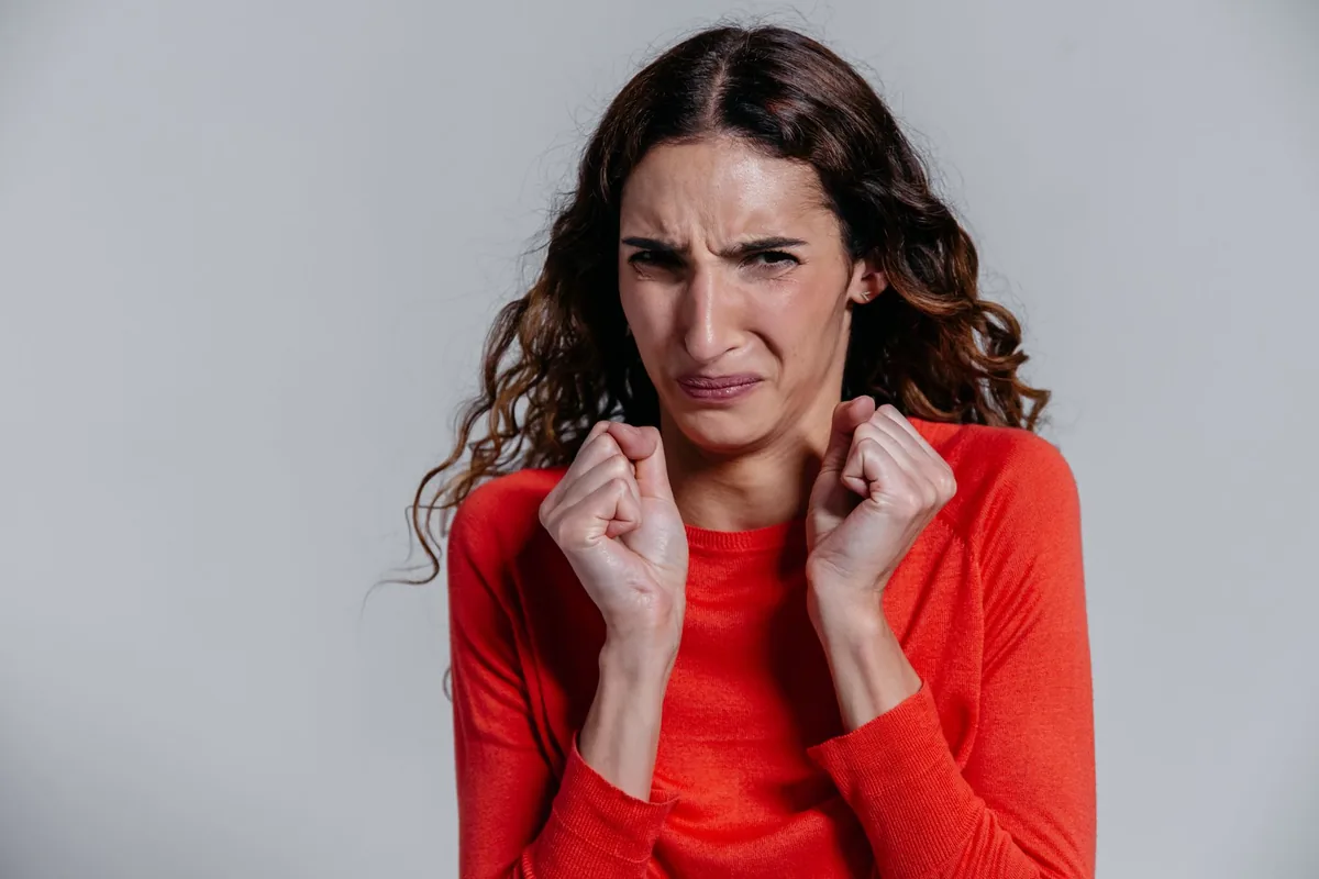 A woman with a disgusted facial expression.